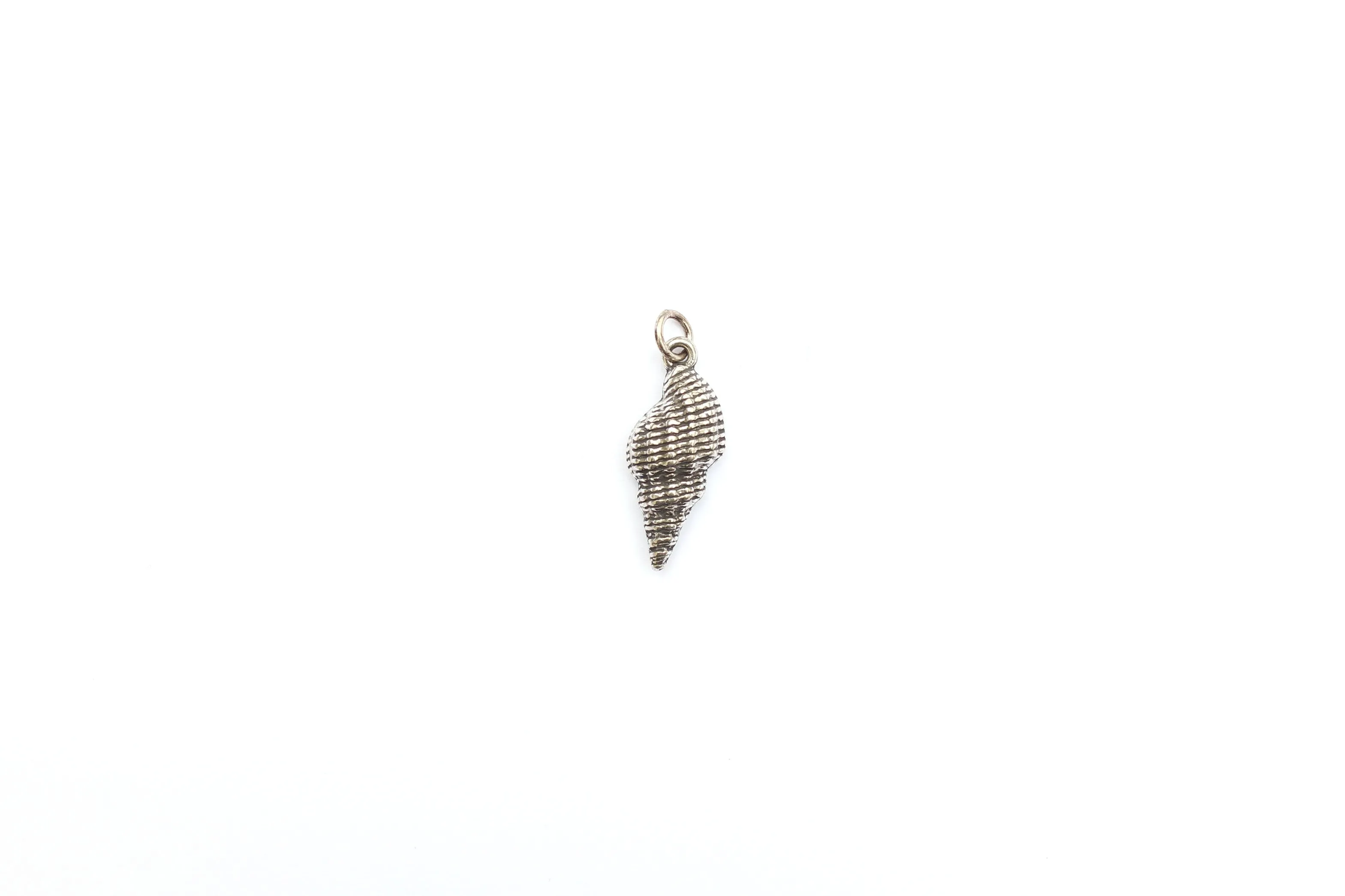 Spiral Shell Charm in Britannium – Oceanic Elegance in Metal Form